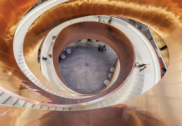 Looking down at the helix staircase at the Experimentarium building by CEBRA Architecture - a science museum in Copenhagen. 