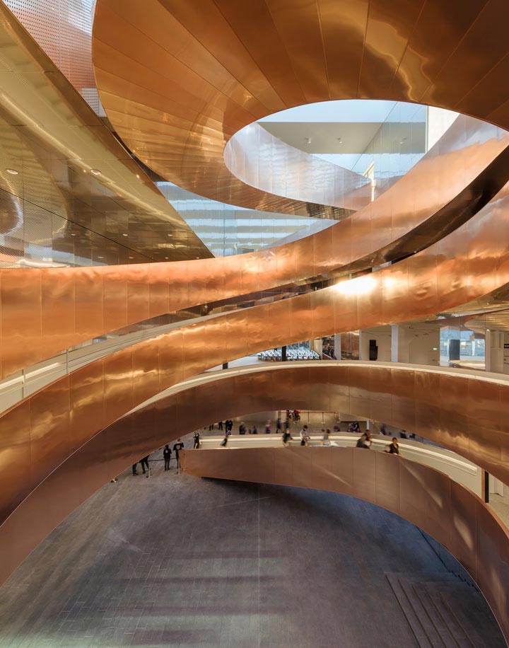 Staircase built from 160 tons of steel clad with 10 tons of copper. Experimentarium building by CEBRA Architecture. 